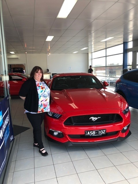 Robyn beside Mustang