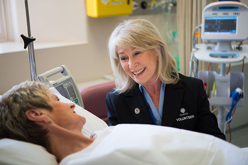 Margaret McKelvie takes the time to visit a patient and offers her support through companionship
