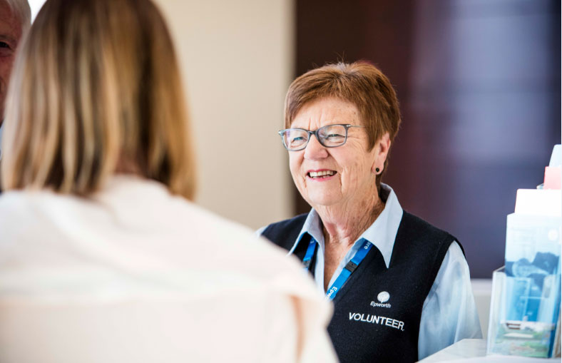 Joan Cunningham assists a patient with an enquiry on entry to the hospital at the Geelong Concierge desk